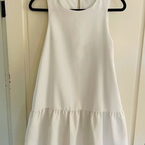 White dress with pockets.
